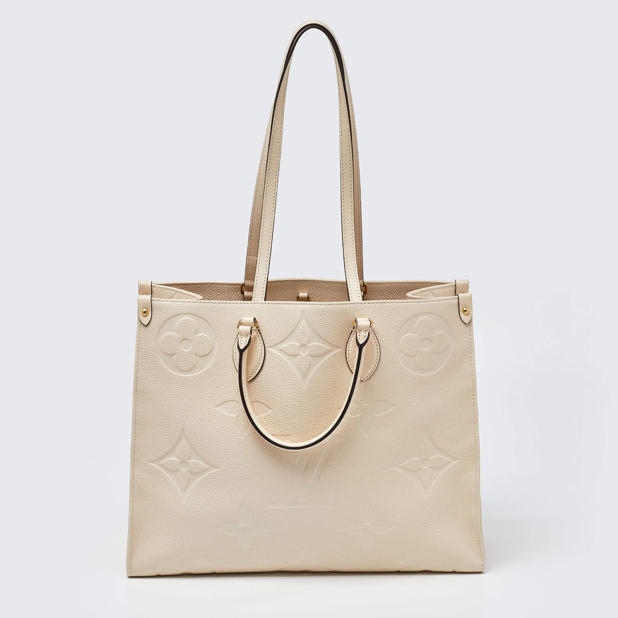Pre Owned Louis Vuitton Creme Monogram Empreinte Leather Onthego GM Bag