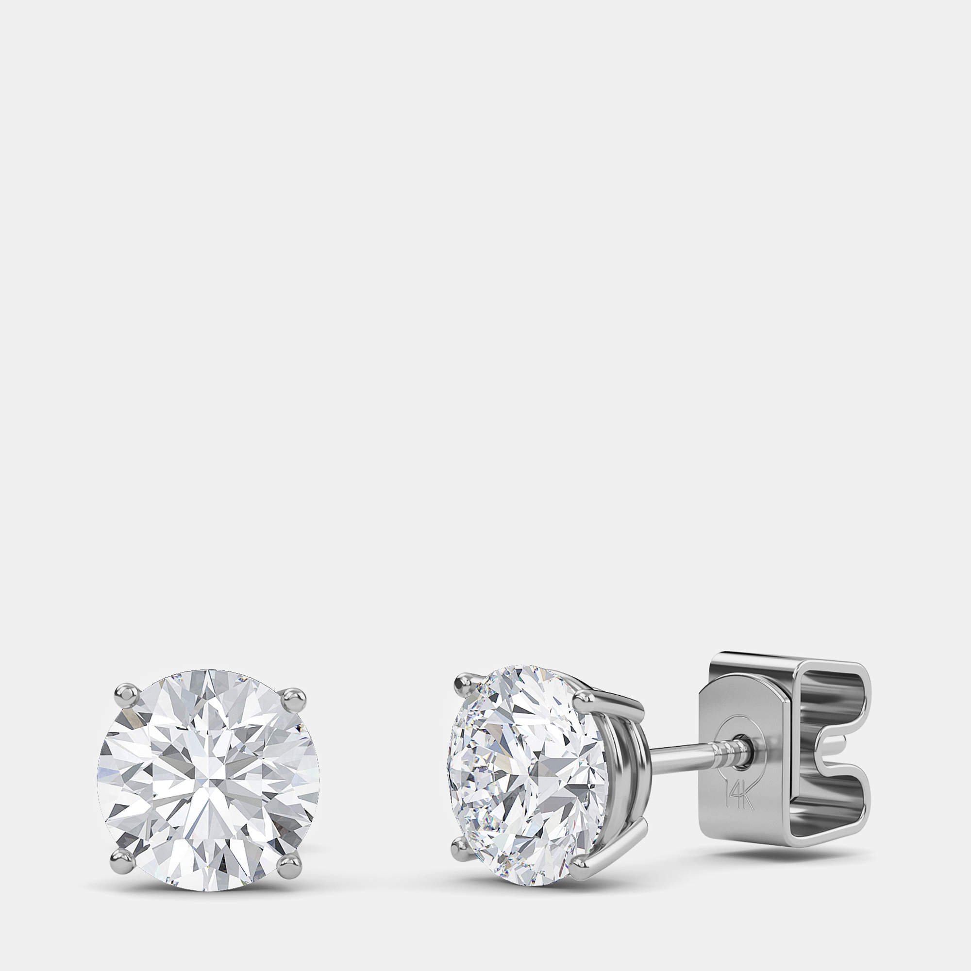 مملوكة مسبقًا 14K Round Four Prong Basket Solitaire Earrings (1/3 Ctw)