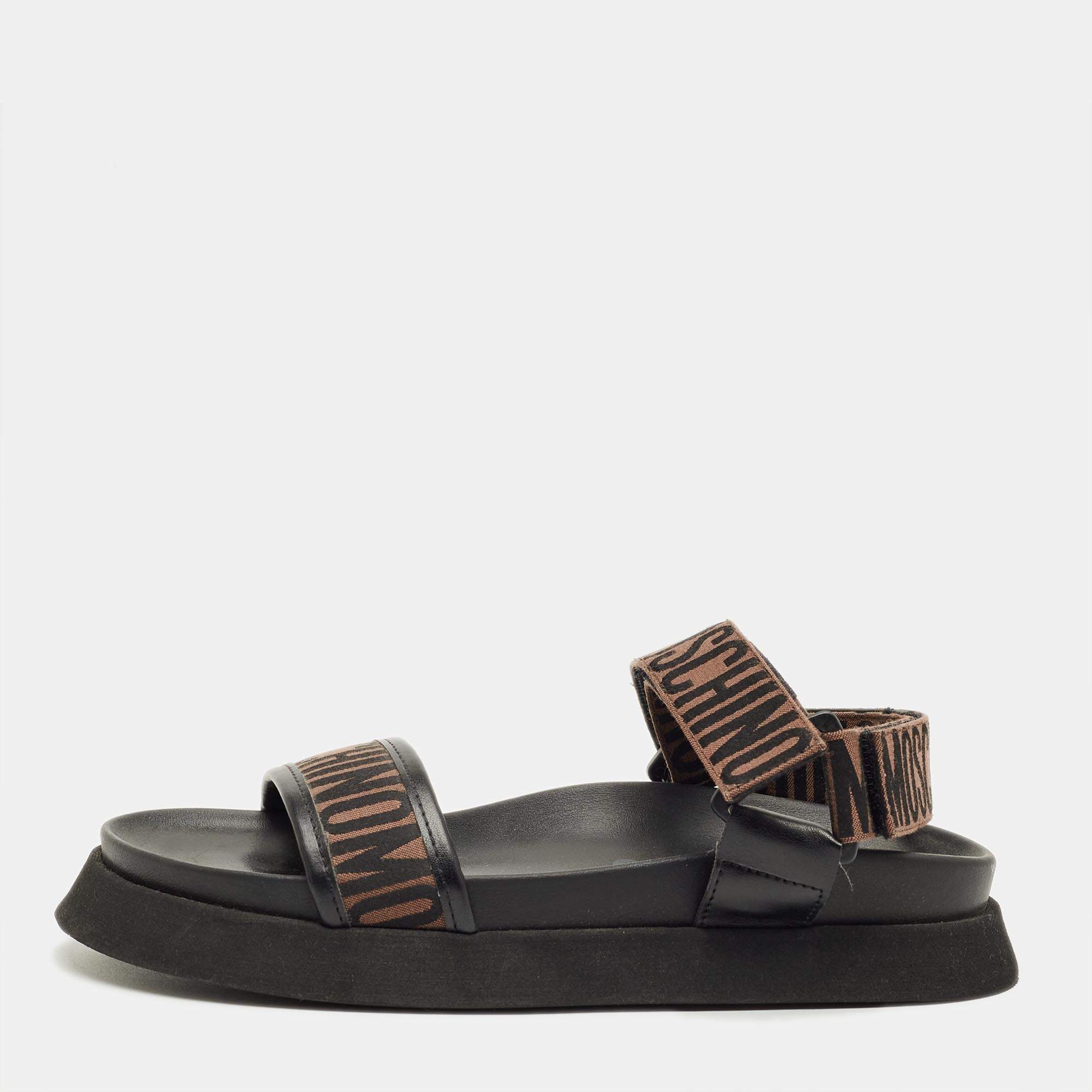 Pre Owned Moschino Brown/Black Canvas Logo Ankle Strap Flat Sandals Size 37