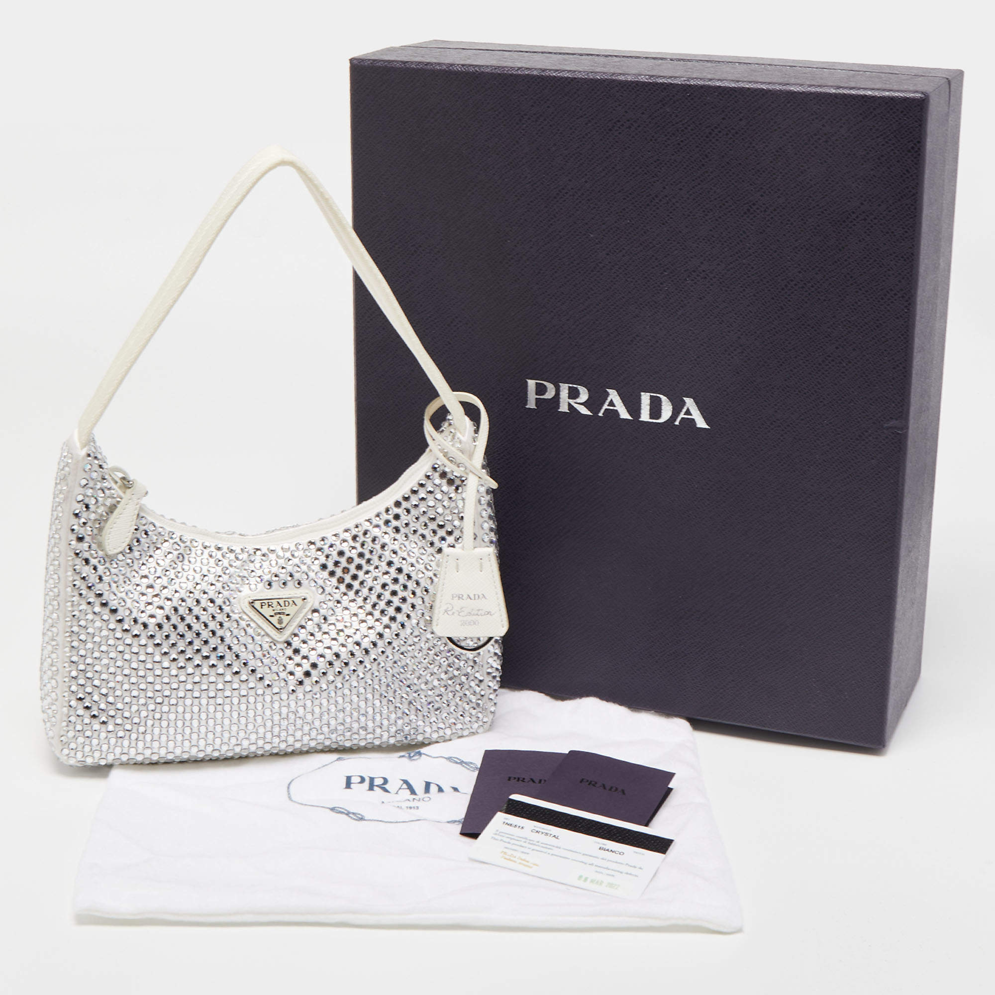 Prada White Crystal Nylon Re-Edition 2000 Baguette Bag at 1stDibs  white  crystal prada bag, prada white baguette bag, prada crystal bag