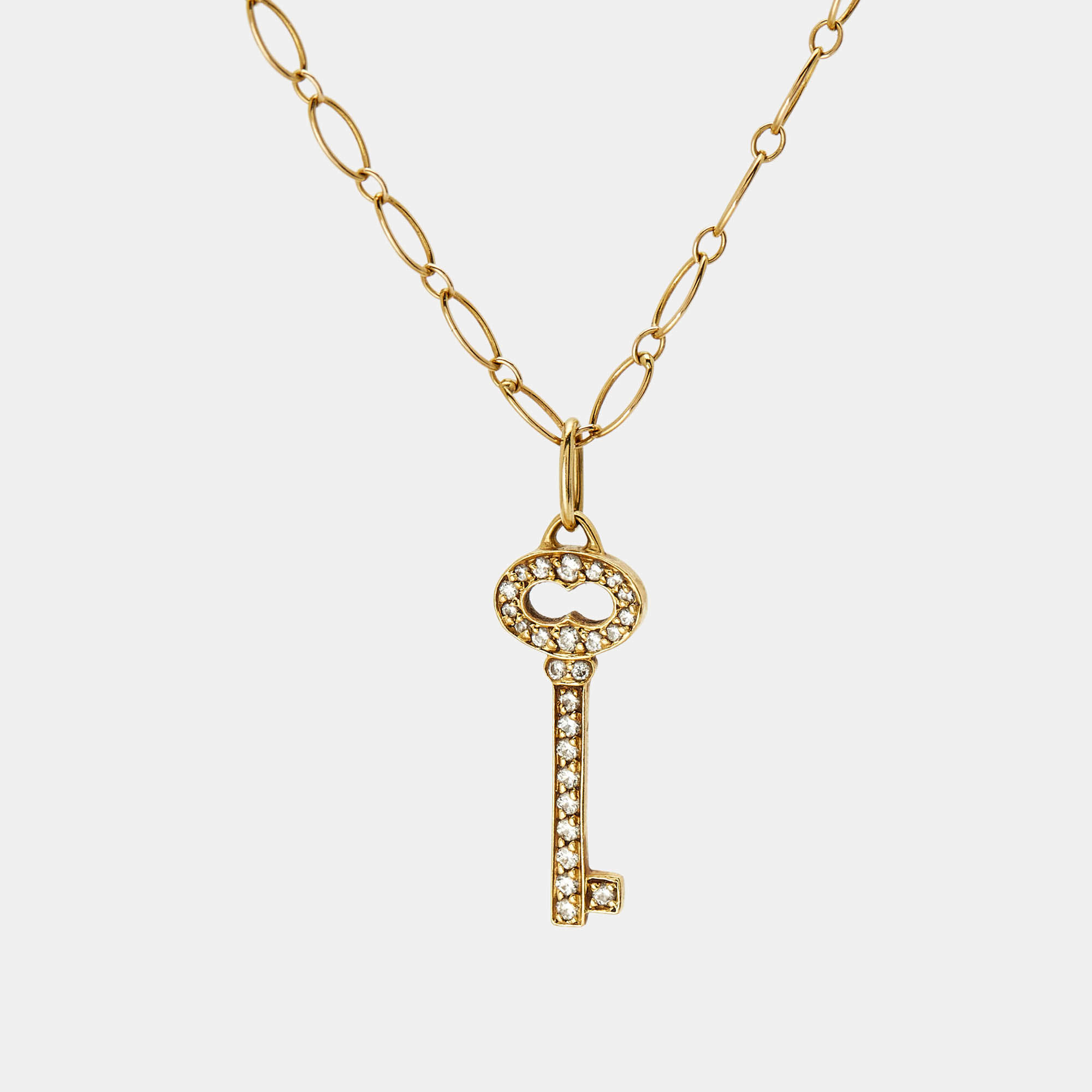 Pre Owned Tiffany & Co. Vintage Oval Key Diamond 18K Yellow Gold Mini Pendant Necklace