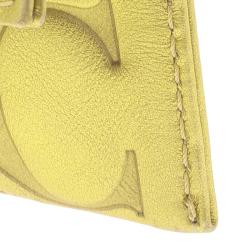 Pre Owned Carolina Herrera Gold Monogram Leather Tassel Clutch