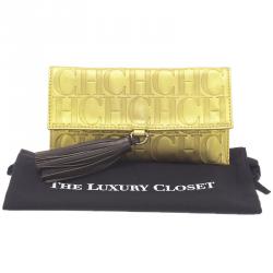 Pre Owned Carolina Herrera Gold Monogram Leather Tassel Clutch