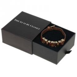 Pre Owned Carolina Herrera Enameled CH Logo Brown Leather Gold Tone Bracelet