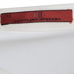 مملوكة مسبقًا بلوزة سي أتش كارولينا هيريرا حرير كريمي بكشكشة مزينة L