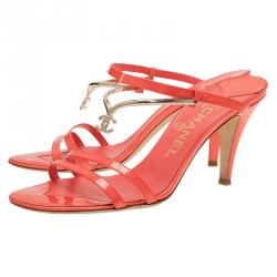 Pre Owned صندل سلايد شانيل جلد برتقالي و شعار ذهبي بسيور مقاس 38