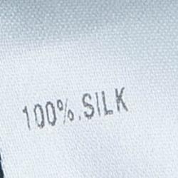 Pre Owned تنورة كلوي حرير خضراء بحافة مكشكشة M