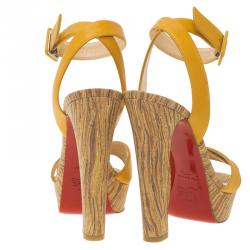 مملوكة مسبقًا صندل كريستيان لوبوتان جلد أصفر بسيور متعاكسة و حزام للكاحل نعل سميك مقاس 37.5