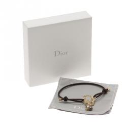 Pre Owned سوار ديور كريستال بالشعار ذهبي اللون بحبل بني قابل للمط