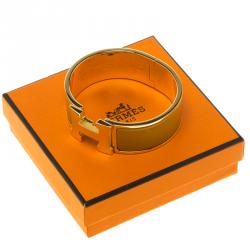 Pre Owned Hermes Clic Clac H Orange Enamel Gold Plated Wide Bracelet PM