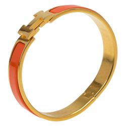 Pre Owned Hermes Clic Clac H Orange Enamel Gold Plated Narrow Bracelet GM