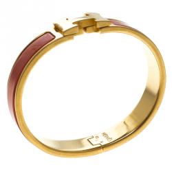 Pre Owned Hermes Clic Clac H Orange Enamel Gold Plated Narrow Bracelet PM