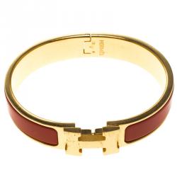 Pre Owned Hermes Clic Clac H Orange Enamel Gold Plated Narrow Bracelet PM