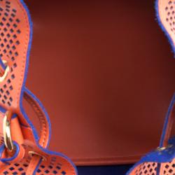 Pre Owned Moschino Orange Perforated Leather Drawstring Bucket Hobo