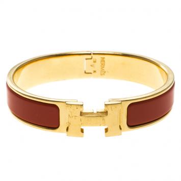 Pre Owned Hermes Clic Clac H Orange Enamel Gold Plated Narrow Bracelet PM