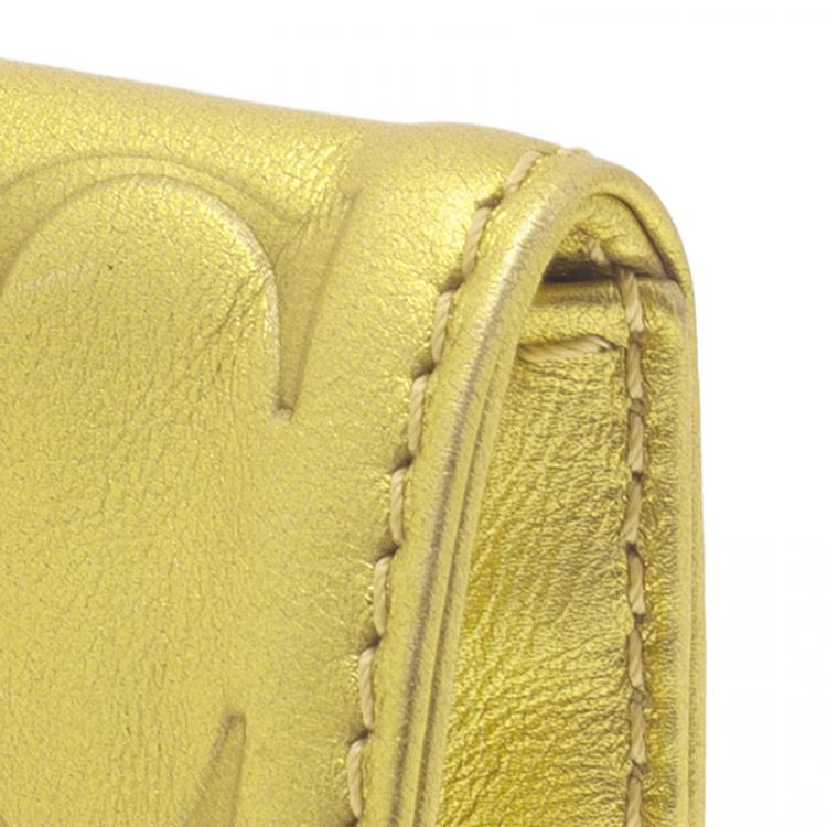 Pre Owned Carolina Herrera Gold Monogram Leather Tassel Clutch