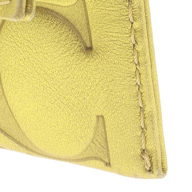 Pre Owned Carolina Herrera Gold Monogram Leather Tassel Clutch