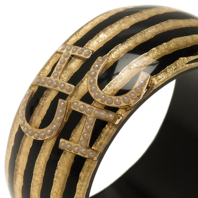 Pre Owned CH Carolina Herrera Black and Gold Resin Bangle Bracelet