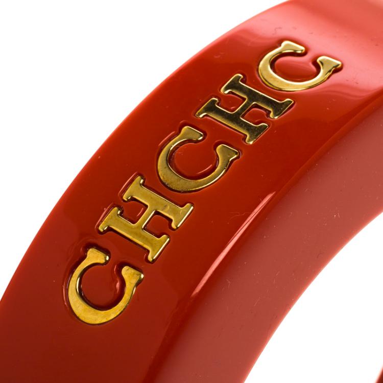 Pre Owned CH Carolina Herrera Orange Resin Gold Tone Wide Bangle 20 cm
