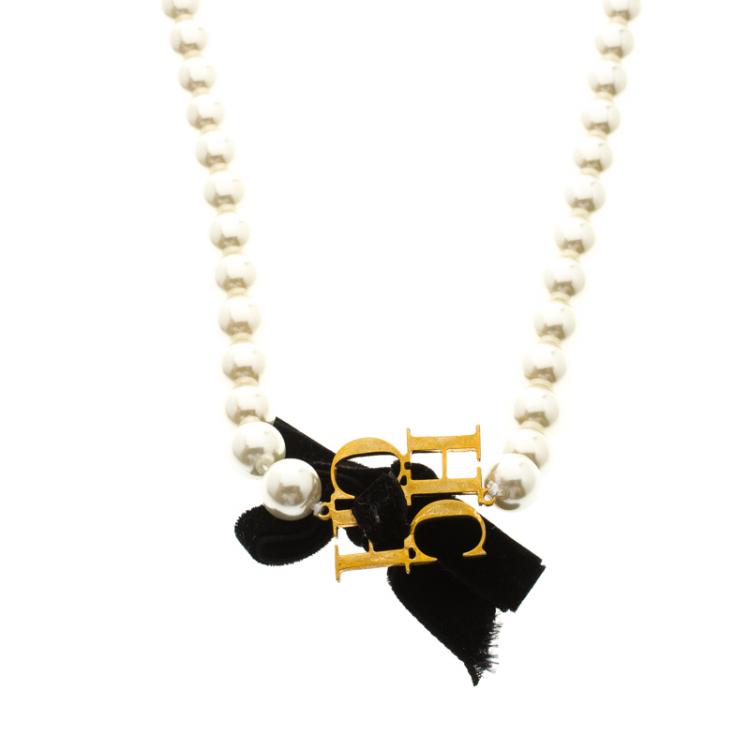 Pre Owned Carolina Herrera Faux Pearl Gold Tone CH Logo Long Necklace
