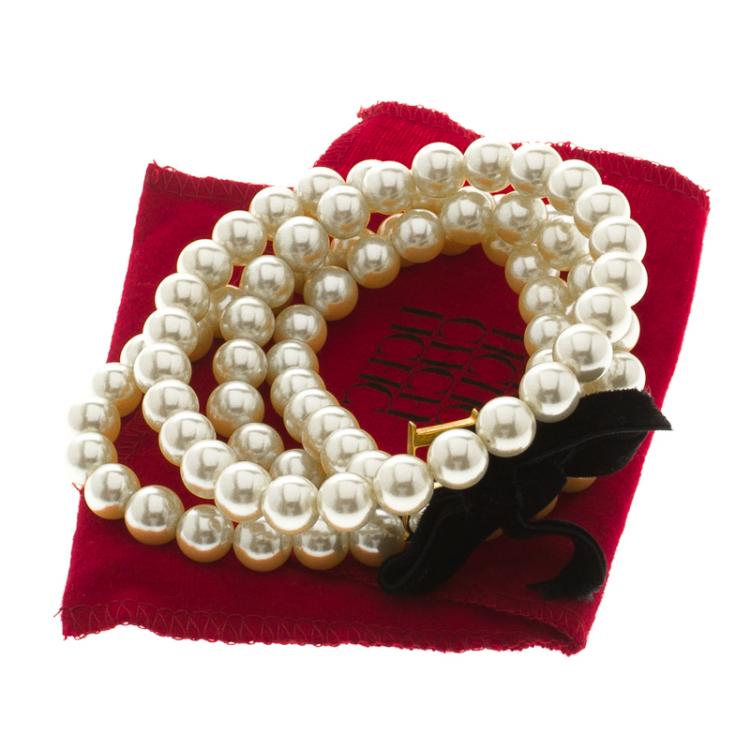 Pre Owned Carolina Herrera Faux Pearl Gold Tone CH Logo Long Necklace