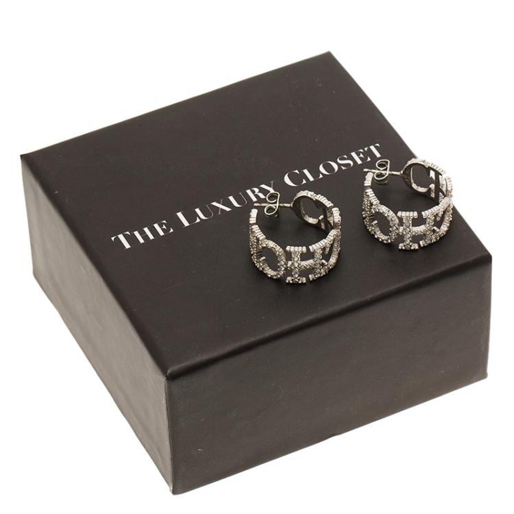 Pre Owned CH Carolina Herrera Crystal Studded Logo Silver Tone Earrings