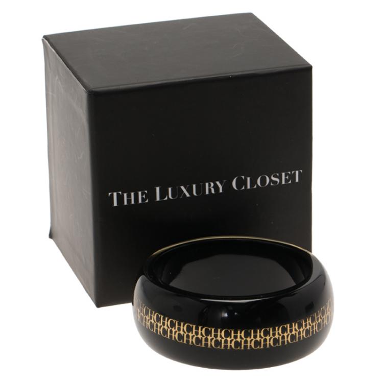 Pre Owned CH Carolina Herrera Black Resin Gold Tone Metal Wide Bangle 20cm