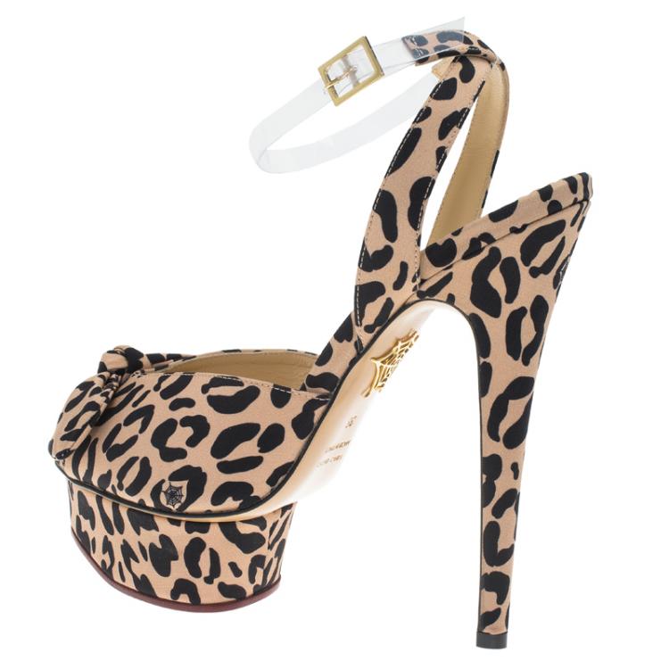 مملوكة مسبقًا Charlotte Olympia Beige Leopard Print Satin Serena Bow Ankle Strap Platform Sandals Size 38
