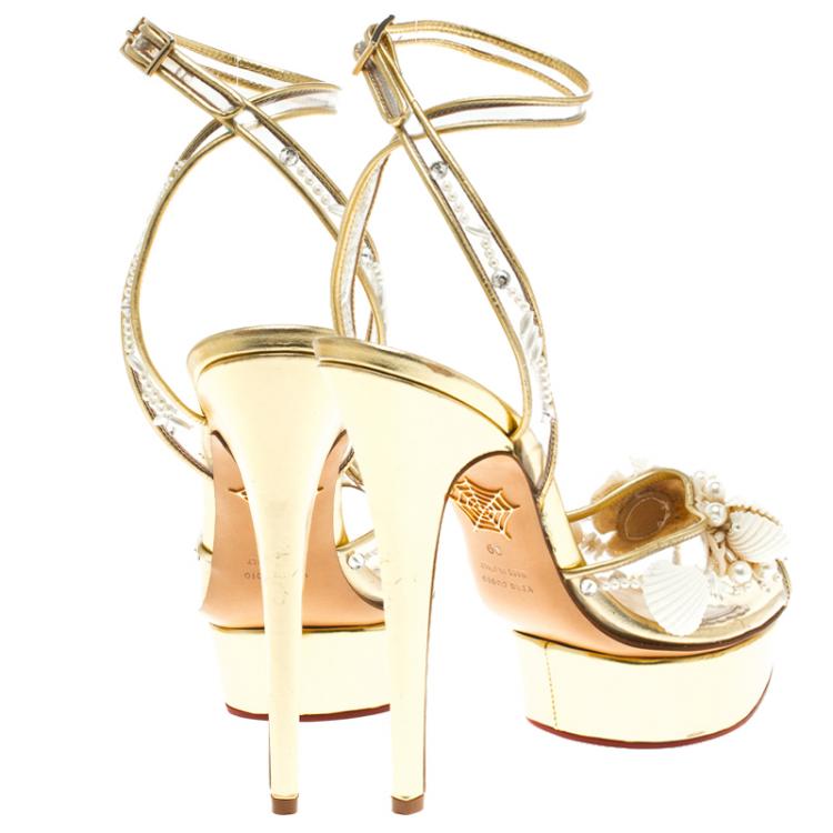 Pre Owned Charlotte Olympia Gold Leather and PVC She Sells Sea Shells Ankle Wrap Platform Sandals Size 39