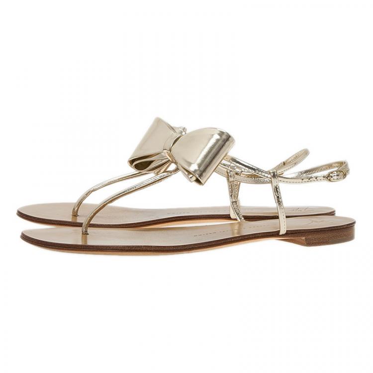 Pre Owned Giuseppe Zanotti Metallic Gold Leather Bow Thong Sandals Size 39