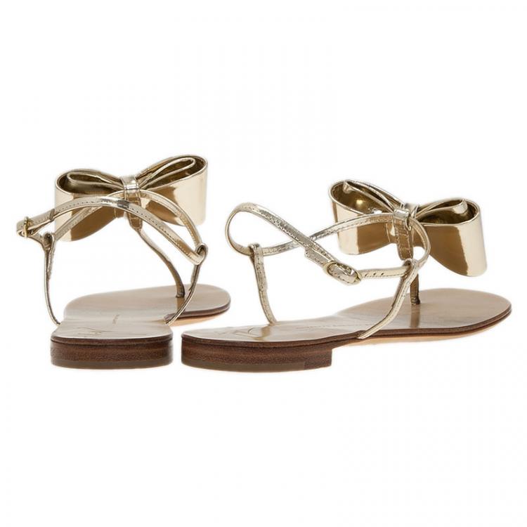 Pre Owned Giuseppe Zanotti Metallic Gold Leather Bow Thong Sandals Size 39