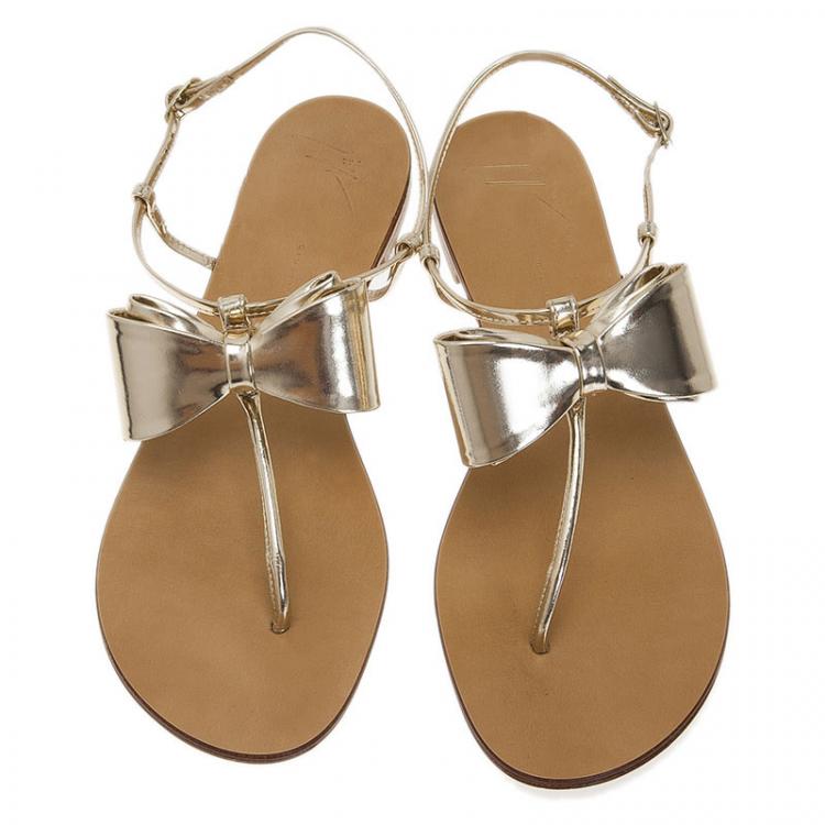 Pre Owned Giuseppe Zanotti Metallic Gold Leather Bow Thong Sandals Size 39