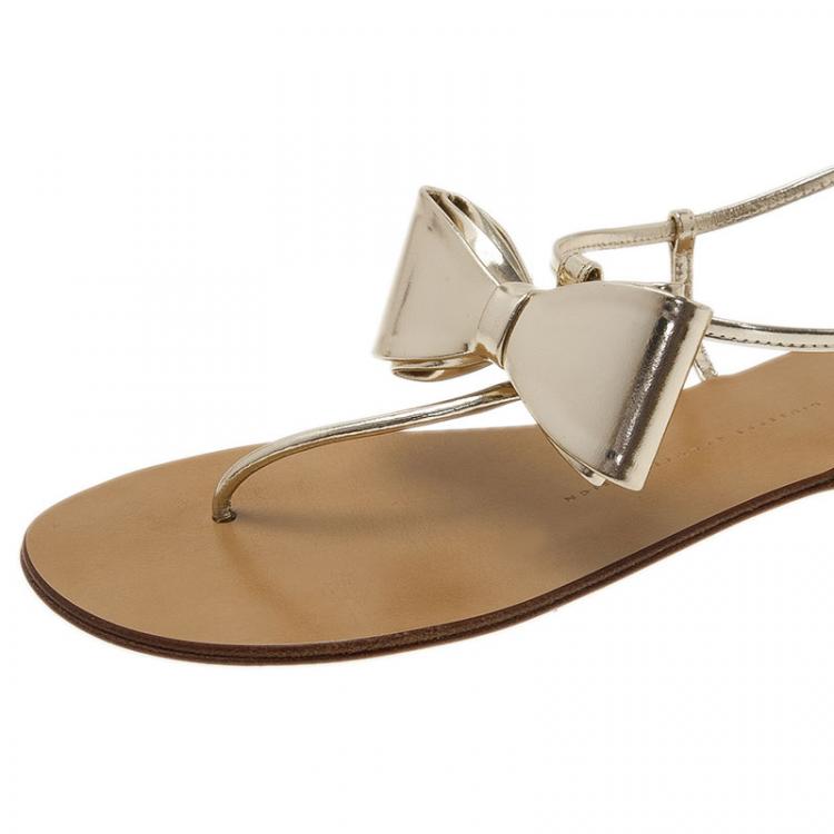 Pre Owned Giuseppe Zanotti Metallic Gold Leather Bow Thong Sandals Size 39