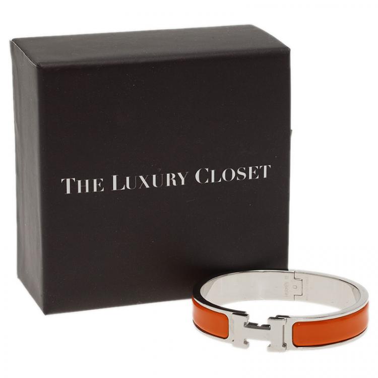 Pre Owned Hermes Clic Clac H Orange Enamel Palladium Plated Bracelet