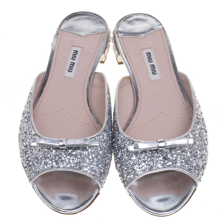 Pre Owned Miu Miu Silver Glitter Bow Detail Jeweled Heel Flat Slides Size 38