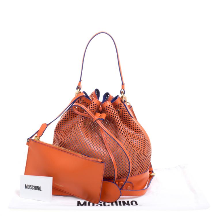 Pre Owned Moschino Orange Perforated Leather Drawstring Bucket Hobo