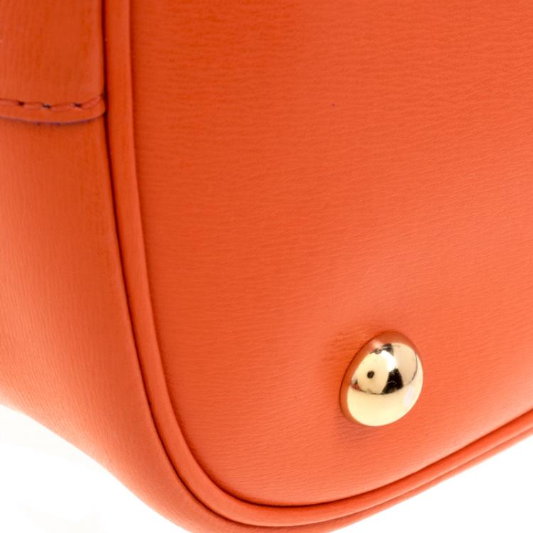 Pre Owned Moschino Orange Perforated Leather Drawstring Bucket Hobo