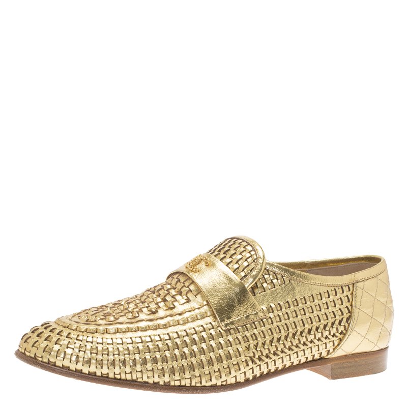 Chanel store gold loafers