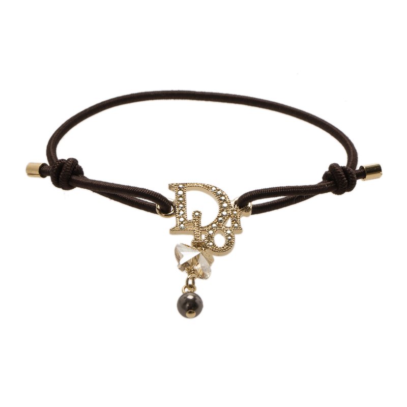 Pre Owned سوار ديور كريستال بالشعار ذهبي اللون بحبل بني قابل للمط