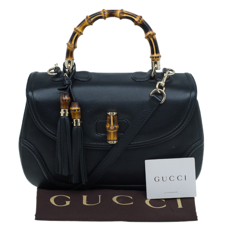 black gucci purse with tassel