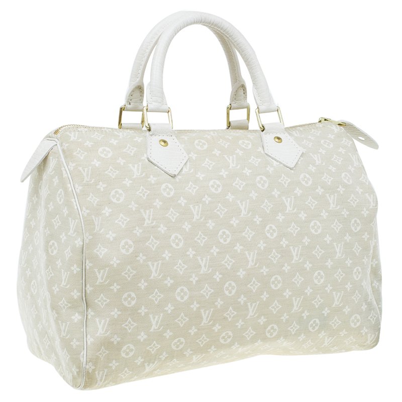 Louis Vuitton Monogram Mini Lin Speedy (2007)! The color is Dune, which  is sort of an off white. This bag is sporty a…