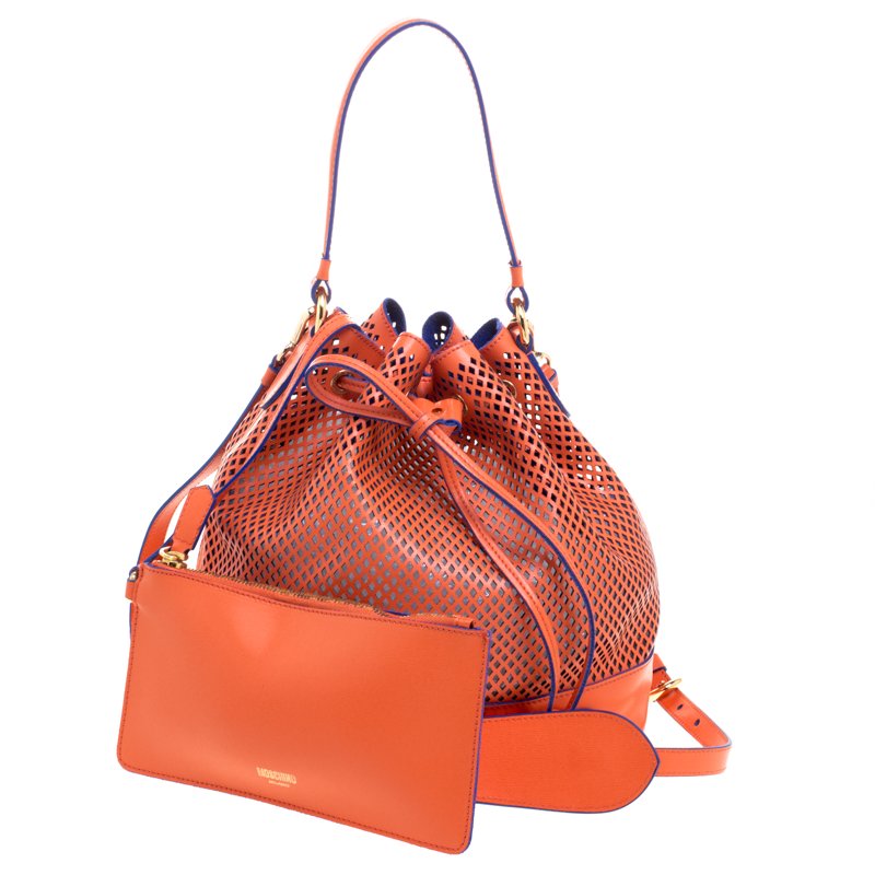 Pre Owned Moschino Orange Perforated Leather Drawstring Bucket Hobo