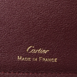 Pre Owned محفظة كارتييه "موست دو كارتييه 6 سي سي" ثنائية الطية جلد عنابي