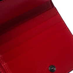 Pre Owned Christian Louboutin Neon Orange Leather Clipsos Studded Bifold Wallet