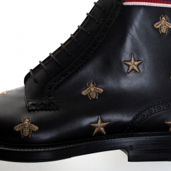 Pre Owned بوت كاحل غوتشي بروغ جلد نقش نجمة ونحلة ذهبي / اسود مقاس 44