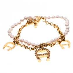 Pre Owned Aigner Crystal Logo Charm and Faux Pearl Gold Plated Layered Bracelet