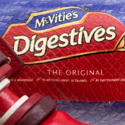 Pre Owned Anya Hindmarch Red Python Embossed Digestives Print Leather Wristlet Pouch