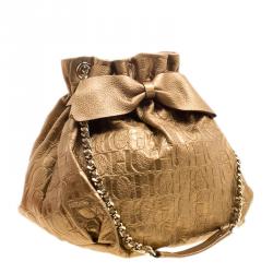 Pre Owned Carolina Herrera Gold Monogram Embossed Leather Bow Bucket Shoulder Bag
