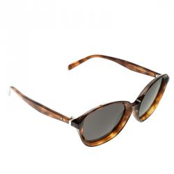 Buy designer Sunglasses by prada at The Luxury Closet.