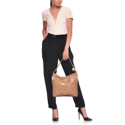 Pre Owned Chanel Tan Quilted Glossy Leather Drawstring 22 Bag